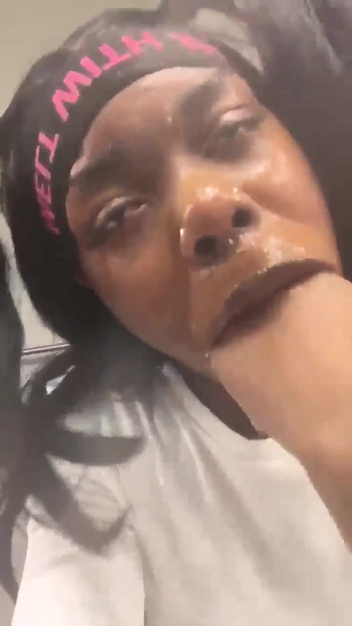 Ebony chick rubs spit all over her face